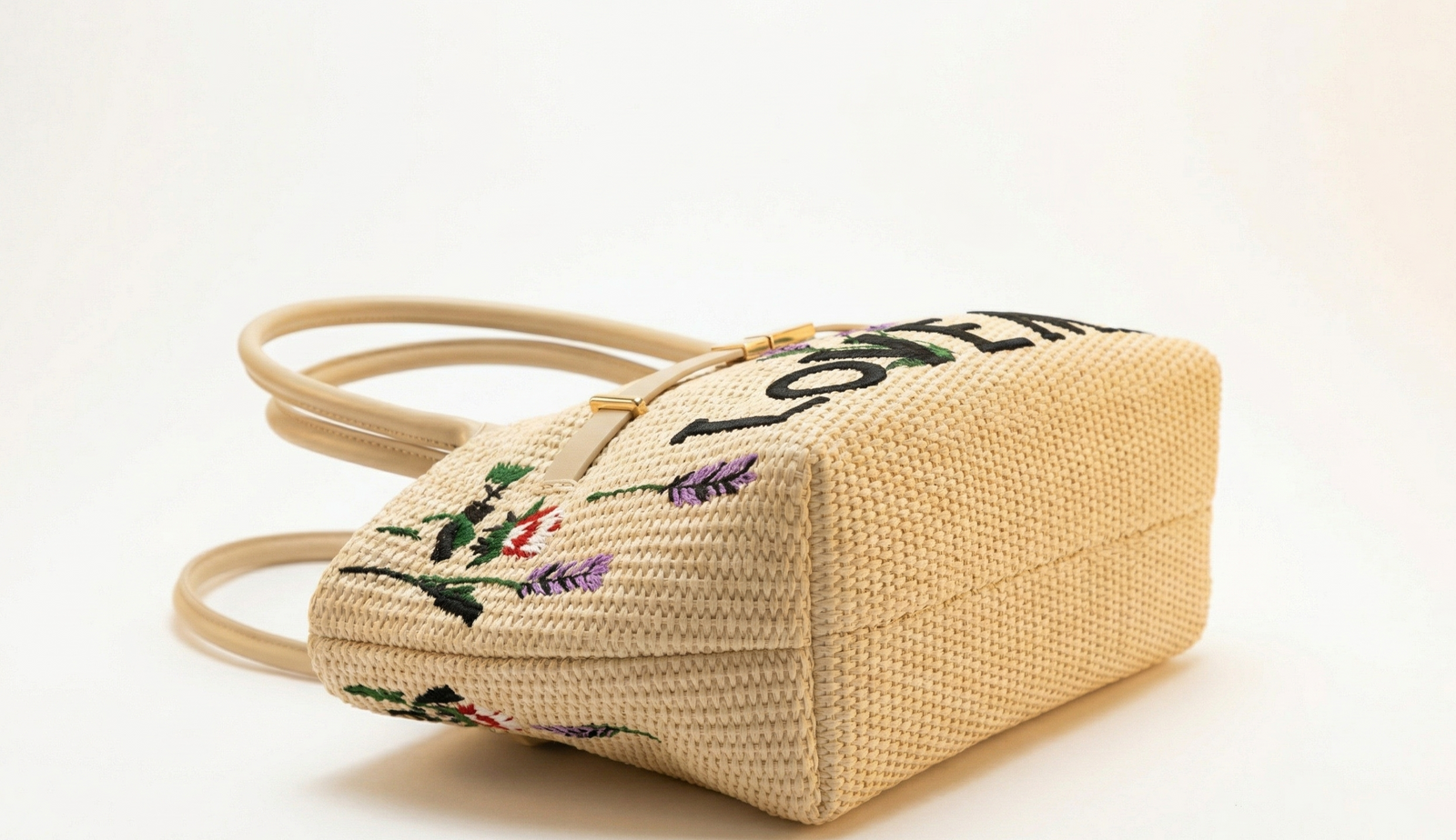 Bolso trenzado beige con estampado florar